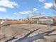 Backyard featuring a detached carport, providing covered parking and potential storage, along with an expansive driveway area at 4592 Gordon Dr, Plainfield, IN 46168