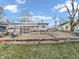 Wide shot of the backyard featuring multiple patios, gravel areas and utility access at 4592 Gordon Dr, Plainfield, IN 46168