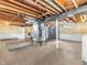 Versatile basement space with exposed wood beams and ductwork, providing ample storage or conversion opportunities at 4592 Gordon Dr, Plainfield, IN 46168