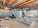 Spacious unfinished basement with exposed beams and ductwork, offering potential for customization and additional living space at 4592 Gordon Dr, Plainfield, IN 46168