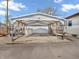 Covered carport with concrete pad and access to utility storage shed and home at 4592 Gordon Dr, Plainfield, IN 46168