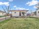 Charming single-story home with a well-manicured lawn, featuring a cozy front porch and complementary yard decor at 4592 Gordon Dr, Plainfield, IN 46168