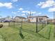 Charming home featuring a well-maintained lawn, a secure chain-link fence, and inviting curb appeal at 4592 Gordon Dr, Plainfield, IN 46168