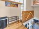 Hallway landing with decorative shelving and open access to the living area below, showcasing modern home design at 4592 Gordon Dr, Plainfield, IN 46168