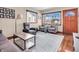 Bright living room with modern furnishings, hardwood floors, and large windows providing ample natural light at 4592 Gordon Dr, Plainfield, IN 46168