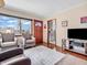 Inviting living area with hardwood flooring, cozy seating, and an open doorway leading to other areas of the home at 4592 Gordon Dr, Plainfield, IN 46168