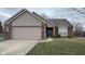 Charming single-Gathering home featuring brick and siding, a two-car garage, and well-maintained lawn and landscaping at 4819 Lakestone Dr, Indianapolis, IN 46237