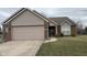 Charming single-Gathering home featuring brick and siding, a two-car garage, and well-maintained lawn and landscaping at 4819 Lakestone Dr, Indianapolis, IN 46237