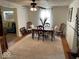 Dining room featuring a dining table, rug, and adjacent living room at 542 N Tremont St, Indianapolis, IN 46222