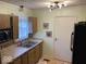 Functional kitchen with a stainless steel sink and light fixtures at 542 N Tremont St, Indianapolis, IN 46222