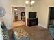 Living room with neutral colors, a decorative ottoman, and fireplace at 542 N Tremont St, Indianapolis, IN 46222