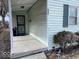 Covered porch featuring secure screen door, siding, and trimmed windows at 542 N Tremont St, Indianapolis, IN 46222