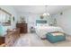 Bright bedroom with blue accents, plantation shutters, and plenty of vintage touches at 6103 Lazy Ln, Indianapolis, IN 46259