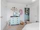 Cozy bedroom with a dresser, TV, and closet space at 6103 Lazy Ln, Indianapolis, IN 46259