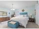 Cozy bedroom features a plush bed with elegant bedding and a decorative vintage furniture at 6103 Lazy Ln, Indianapolis, IN 46259