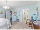 Stylish bedroom featuring neutral walls, vintage furniture, and a rocking chair at 6103 Lazy Ln, Indianapolis, IN 46259