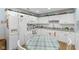 White kitchen featuring a large refrigerator, modern appliances, and ample counter space at 6103 Lazy Ln, Indianapolis, IN 46259