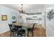 Light and airy kitchen with granite counters, an island, and white cabinets at 6103 Lazy Ln, Indianapolis, IN 46259