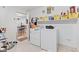 Laundry room with washer, dryer, and storage shelf at 6103 Lazy Ln, Indianapolis, IN 46259