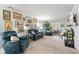 Spacious living room with comfortable seating, fireplace, and carpeted floors at 6103 Lazy Ln, Indianapolis, IN 46259
