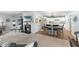 Open concept living area with a fireplace and kitchen with a breakfast bar at 6103 Lazy Ln, Indianapolis, IN 46259
