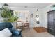 Inviting living room with hardwood floors, white door, and a large window at 6103 Lazy Ln, Indianapolis, IN 46259