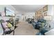 Bright living room featuring a fireplace, furniture and adjacent dining area at 6103 Lazy Ln, Indianapolis, IN 46259