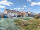 Spacious backyard featuring a covered patio, shed, and well-manicured lawn offering a perfect space for outdoor activities and relaxation at 6905 Percy Dr, Indianapolis, IN 46113
