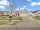 Charming home featuring a well-maintained lawn, a two-car garage, and a mailbox offering curb appeal and practicality at 6905 Percy Dr, Indianapolis, IN 46113