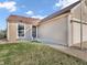 Home with beige siding and a manicured lawn, walkway leading to the front door, and a two-car garage at 6905 Percy Dr, Indianapolis, IN 46113