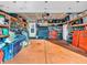 Well-organized garage featuring ample storage space, a workbench, tools, and a bicycle, catering to DIY enthusiasts and hobbyists at 6905 Percy Dr, Indianapolis, IN 46113