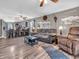 Open concept living room flows into kitchen featuring modern flooring, neutral walls, and comfortable seating at 6905 Percy Dr, Indianapolis, IN 46113