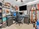 Cozy home office space with carpeted floors, decorative elements, and an executive desk setup at 6905 Percy Dr, Indianapolis, IN 46113