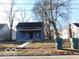 Charming home featuring mature trees, a classic design and a well-maintained lawn at 711 W Centennial Ave, Muncie, IN 47303