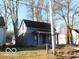 Charming home features a classic design, a cozy front porch, and a well-maintained lawn at 711 W Centennial Ave, Muncie, IN 47303