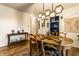 Dining room with hardwood floors, unique light fixture and blue accents at 7671 Sherry Ln, Brownsburg, IN 46112