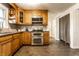 Traditional kitchen features stainless steel appliances, granite counters and wood cabinets at 7671 Sherry Ln, Brownsburg, IN 46112