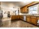 Open kitchen includes tile floors, wooden cabinets and stainless steel dishwasher at 7671 Sherry Ln, Brownsburg, IN 46112