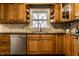 Updated kitchen with granite counters, tile backsplash and stainless steel dishwasher at 7671 Sherry Ln, Brownsburg, IN 46112