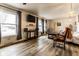 Sun-filled living room featuring wood-look floors and ample natural light at 7671 Sherry Ln, Brownsburg, IN 46112