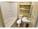 Cozy bathroom features a tub/shower, toilet, and pedestal sink at 823 Collier St, Indianapolis, IN 46241