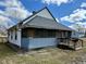 Charming home featuring a covered porch, gray roof, and a well-maintained exterior at 823 Collier St, Indianapolis, IN 46241