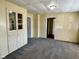Spacious living room with carpet, built-in storage, and a classic design at 823 Collier St, Indianapolis, IN 46241
