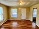 Bright living room features wood flooring and a neutral color scheme at 823 Collier St, Indianapolis, IN 46241