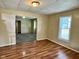 The living room features wood flooring, an open layout, and natural light at 823 Collier St, Indianapolis, IN 46241