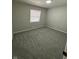 Small bedroom with plush carpets, a window, and neutral walls at 8468 N Baltimore Rd, Monrovia, IN 46157