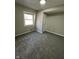 Bedroom with plush carpets, a window, and a closet at 8468 N Baltimore Rd, Monrovia, IN 46157