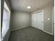 Bedroom with plush carpets, a window with blinds, and a closet at 8468 N Baltimore Rd, Monrovia, IN 46157