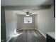 Bright dining area with modern flooring and ceiling fan, adjacent to an updated kitchen at 8468 N Baltimore Rd, Monrovia, IN 46157