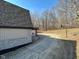 Exterior view of a home's driveway and backyard featuring an additional detached garage at 8468 N Baltimore Rd, Monrovia, IN 46157